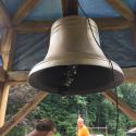 The restored bell is installed on the timber frame